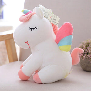 Peluche unicorno seduto